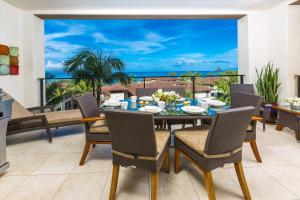 a dining room with a view of the ocean at Luxury & Views At Aqua Lani J305 Wailea Beach Villas! in Wailea