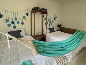 Postel nebo postele na pokoji v ubytování BACALAR INN Hotel