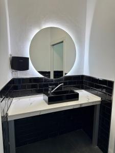 a bathroom with a sink and a mirror at Villa Maréa in Algeciras