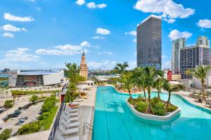 a view of a city skyline with a swimming pool at Ultimate Elegance Studio with Panoramic City Views in Miami
