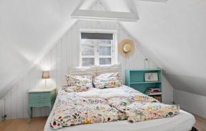 A bed or beds in a room at Awesome Home In Roskilde With Wifi