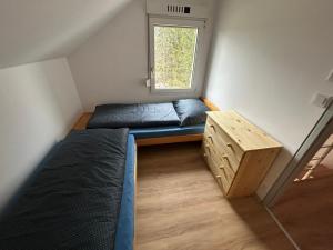 a small room with a bed and a window at U Lipky II in Světlá nad Sázavou +4 photos