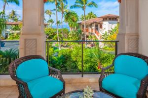 a balcony with chairs and a view of the ocean at Ocean View Luxury, Castaway Cove C201, Wailea Beach Villas! in Wailea