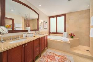 a bathroom with a tub and a sink and a mirror at Ocean View Luxury, Castaway Cove C201, Wailea Beach Villas! in Wailea +32 photos
