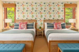 two beds in a room with two windows at Ocean View Luxury, Castaway Cove C201, Wailea Beach Villas! in Wailea