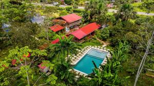 an overhead view of a house with a swimming pool at PuraChata Ecolodge in Iquitos