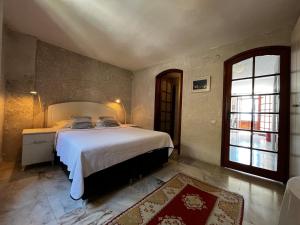 a bedroom with a large bed and a window at Castle81homes White , Sea view house in Marmaris +21 photos