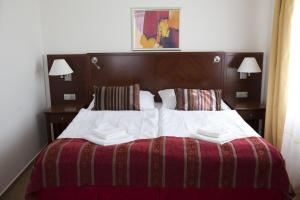 Posteľ alebo postele v izbe v ubytovaní Hotel Atrium