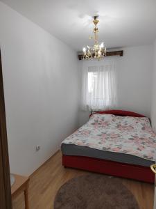 Postel nebo postele na pokoji v ubytování Banja Koviljaca Centar Apartman