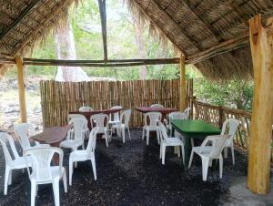 a group of tables and chairs in a pavilion at Polvo en el Aire in Santo Domingo +10 photos