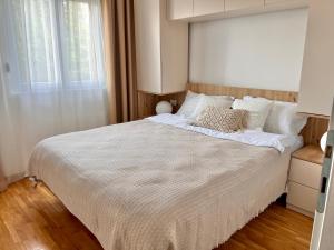 Postel nebo postele na pokoji v ubytování Apartman Sunrise + 25 fotografií