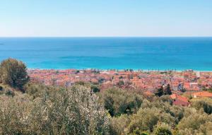 a view of a city with the ocean in the background at Il Giardino Dei Filosofi in Ascea