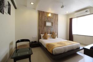 Postel nebo postele na pokoji v ubytování MARIGOLD-Newly Renovated Hotel