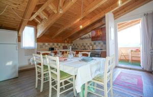 a dining room with a white table and chairs at Amazing Home In Imperia With Wifi in Imperia