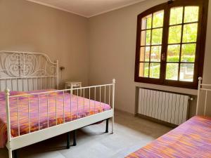 Postel nebo postele na pokoji v ubytování B&B Aria Di Lago