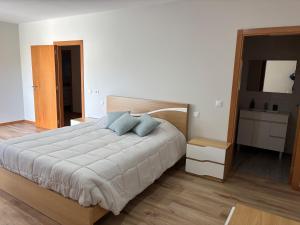 Кровать или кровати в номере Apartamento Duplex Bragança centro