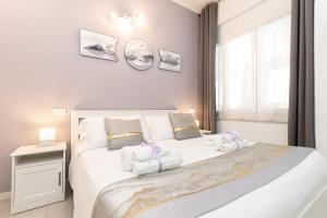 Postel nebo postele na pokoji v ubytování VittorioVeneto126 B&B