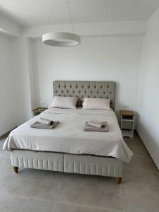 Ένα ή περισσότερα κρεβάτια σε δωμάτιο στο President Apartment Premium Lakeview