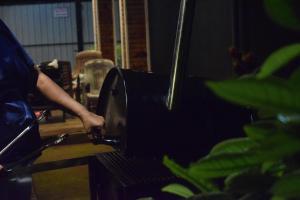 a person is using a machine in a room at Villa Green Garden in Hikkaduwa