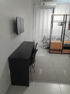 Телевизор и/или развлекательный центр в Loft in the center of Rio