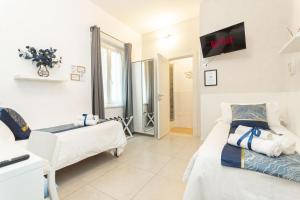 Postel nebo postele na pokoji v ubytování VittorioVeneto126 B&B