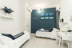 Postel nebo postele na pokoji v ubytování VittorioVeneto126 B&B
