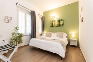 Postel nebo postele na pokoji v ubytování VittorioVeneto126 B&B