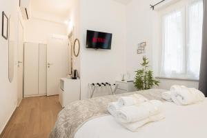 Postel nebo postele na pokoji v ubytování VittorioVeneto126 B&B
