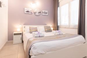 Postel nebo postele na pokoji v ubytování VittorioVeneto126 B&B