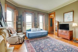 a living room with a bed and a tv at Family Home Near Franklin Historic District in Franklin