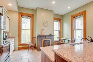 a kitchen with a fireplace and a living room at Family Home Near Franklin Historic District in Franklin
