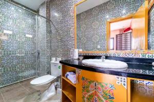 a bathroom with a toilet and a sink and a mirror at Westminster moroc style in London