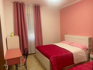 Postel nebo postele na pokoji v ubytování aeroporto room1