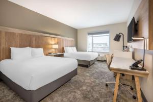 Ένα ή περισσότερα κρεβάτια σε δωμάτιο στο Radisson Hotel Pendleton Airport