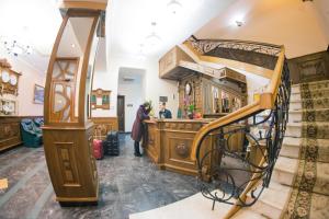 a couple standing at a bar in a house at Hotel Star in Mukacheve +87 photos