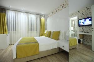 Postel nebo postele na pokoji v ubytování Katelya Hotel
