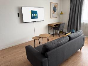 a living room with a couch and a table at ProStays Apartment in Mönchengladbach - 2 Schlafzimmer - 4 Betten in Mönchengladbach