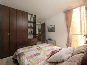 Katil atau katil-katil dalam bilik di Campo Verde-Apartamento en cali