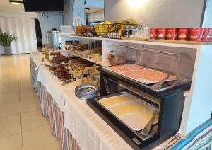a buffet line with food on top of it at Hotel Miramar Playa America Nigran in Nigrán