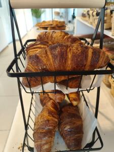 a rack filled with lots of loaves of bread at Hotel Miramar Playa America Nigran in Nigrán