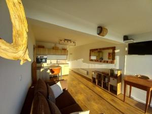 a living room with a couch and a table at PARFUM d'OCEAN in Saint-Pierre-dʼOléron +14 photos