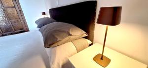 Postel nebo postele na pokoji v ubytování Claudietta by Controluce Casa Vacanze