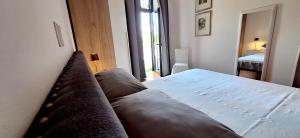 Postel nebo postele na pokoji v ubytování Claudietta by Controluce Casa Vacanze