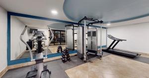 a gym with tread machines and a treadmill at Park Royal Orlando in Kissimmee