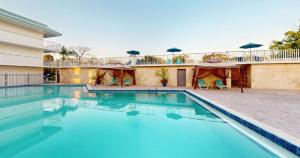 a swimming pool in front of a building at Park Royal Orlando in Kissimmee