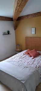 a bedroom with a large bed in a room at Maison familiale Ecole des Filles in Ully-Saint-Georges