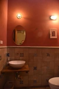 a bathroom with a sink and a mirror at Habitación, balcón frente al mar y alberca in Lerma