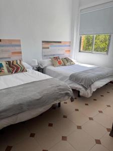 Ένα ή περισσότερα κρεβάτια σε δωμάτιο στο Hostal El Torero