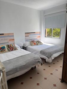 Ένα ή περισσότερα κρεβάτια σε δωμάτιο στο Hostal El Torero