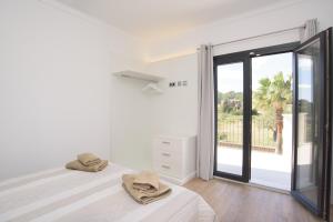 Posteľ alebo postele v izbe v ubytovaní Finca Batlet
